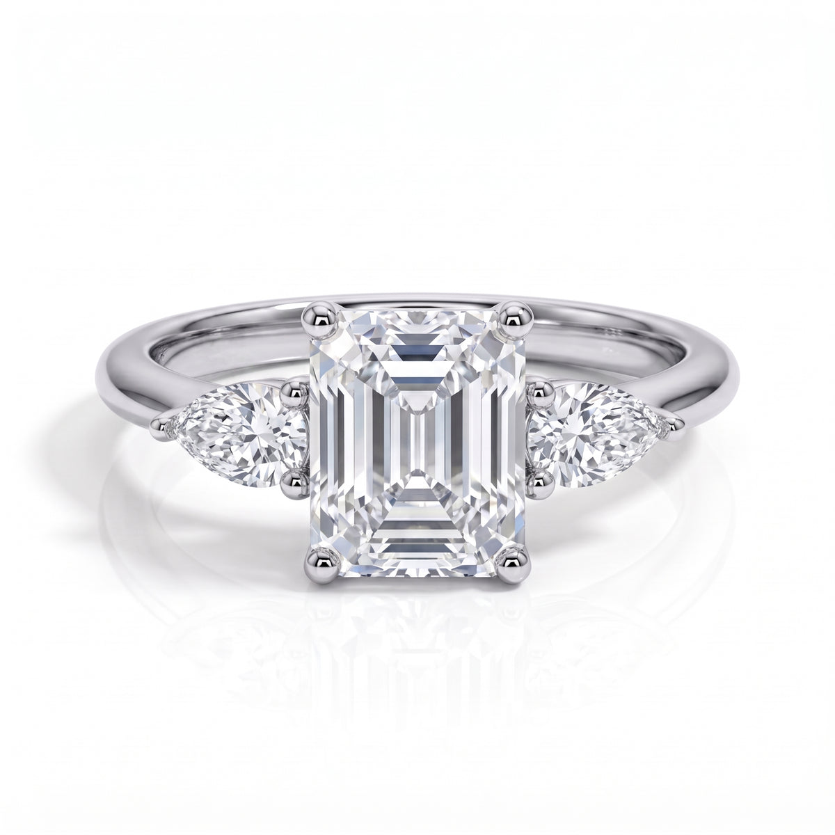 The Clarisse - Emerald & Pear Three-Stone Moissanite Ring